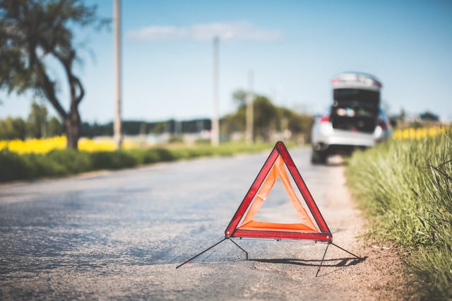 red-warning-triangle-and-broken-car-at-the-side-of-the-road-picjumbo-com.jpg