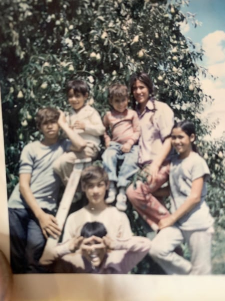 Photo of the Herrera family, including Ed Herrera, VP of Workforce Management Solutions at Populus Group and Bobby Herrera, President and CEO of Populus Group.