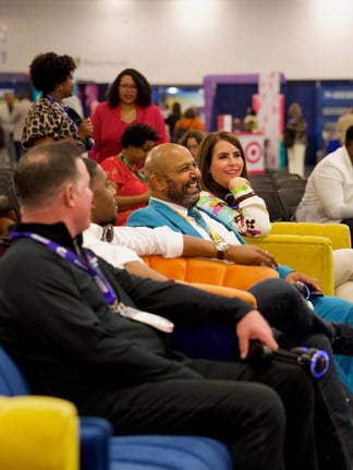Populus Group team members and attendees sitting together at the NMSDC 2025 event, smiling and listening during a session.